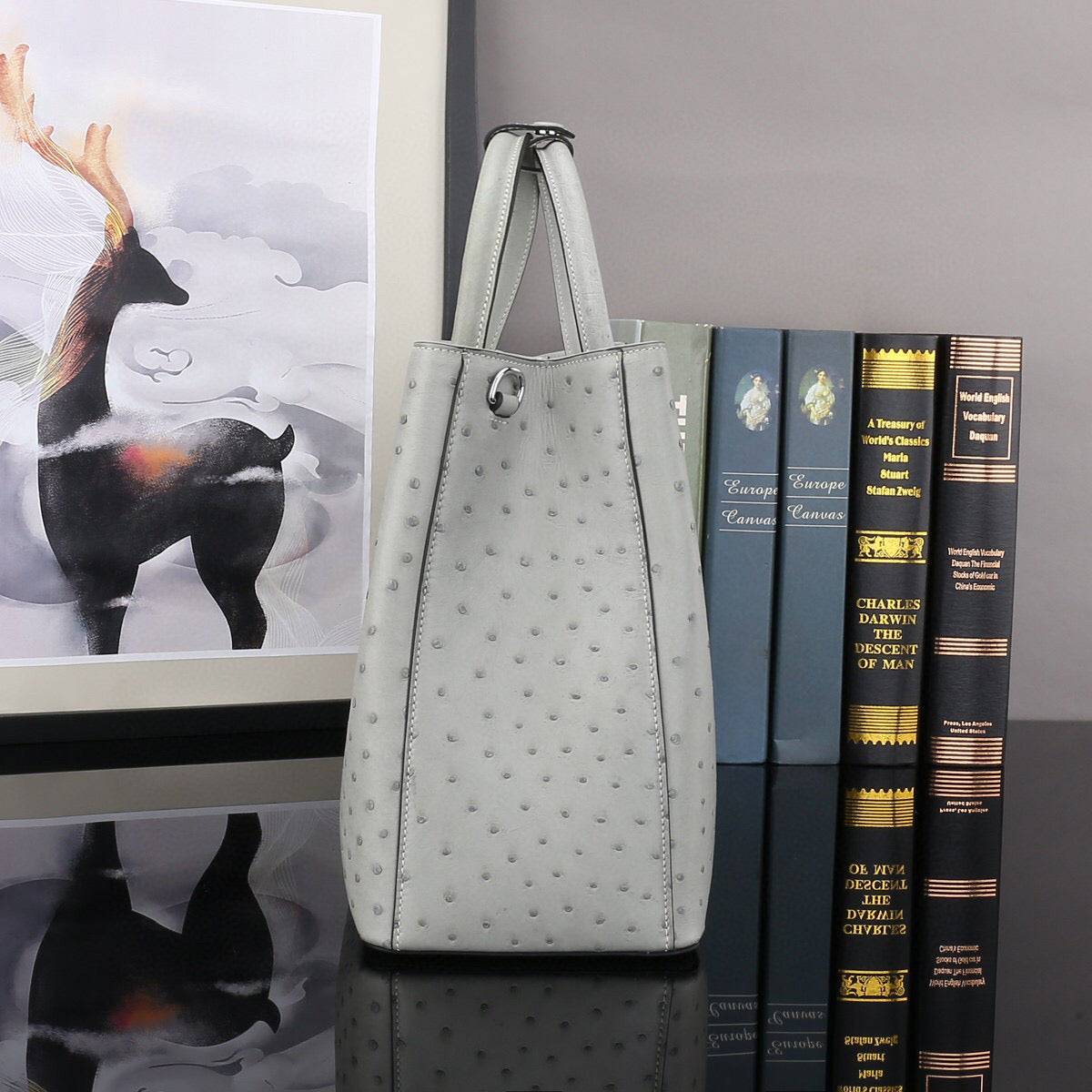 Grey ostrich leather top handle shoulder bag by Rossie Viren, 32cm handbag with textured surface and elegant design.