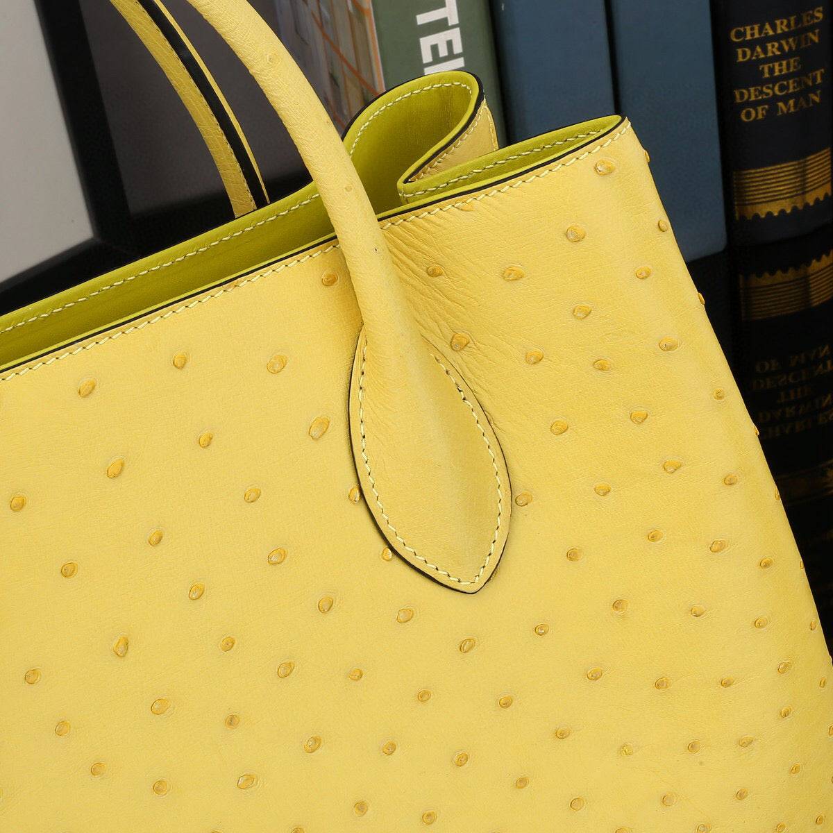 Yellow ostrich leather top handle shoulder bag by Rossie Viren, 32cm handbag with textured exotic leather finish.