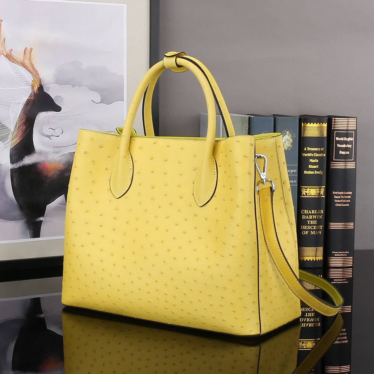 Yellow ostrich leather top handle shoulder bag by Rossie Viren, 32cm handbag with elegant design and textured finish.
