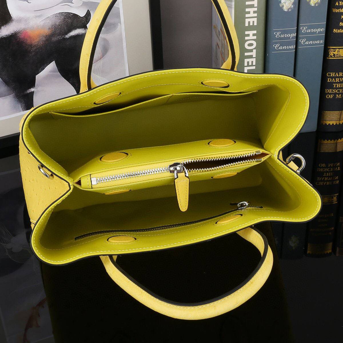 Yellow ostrich leather top handle shoulder bag by Rossie Viren, 32cm handbag with elegant design and textured finish.