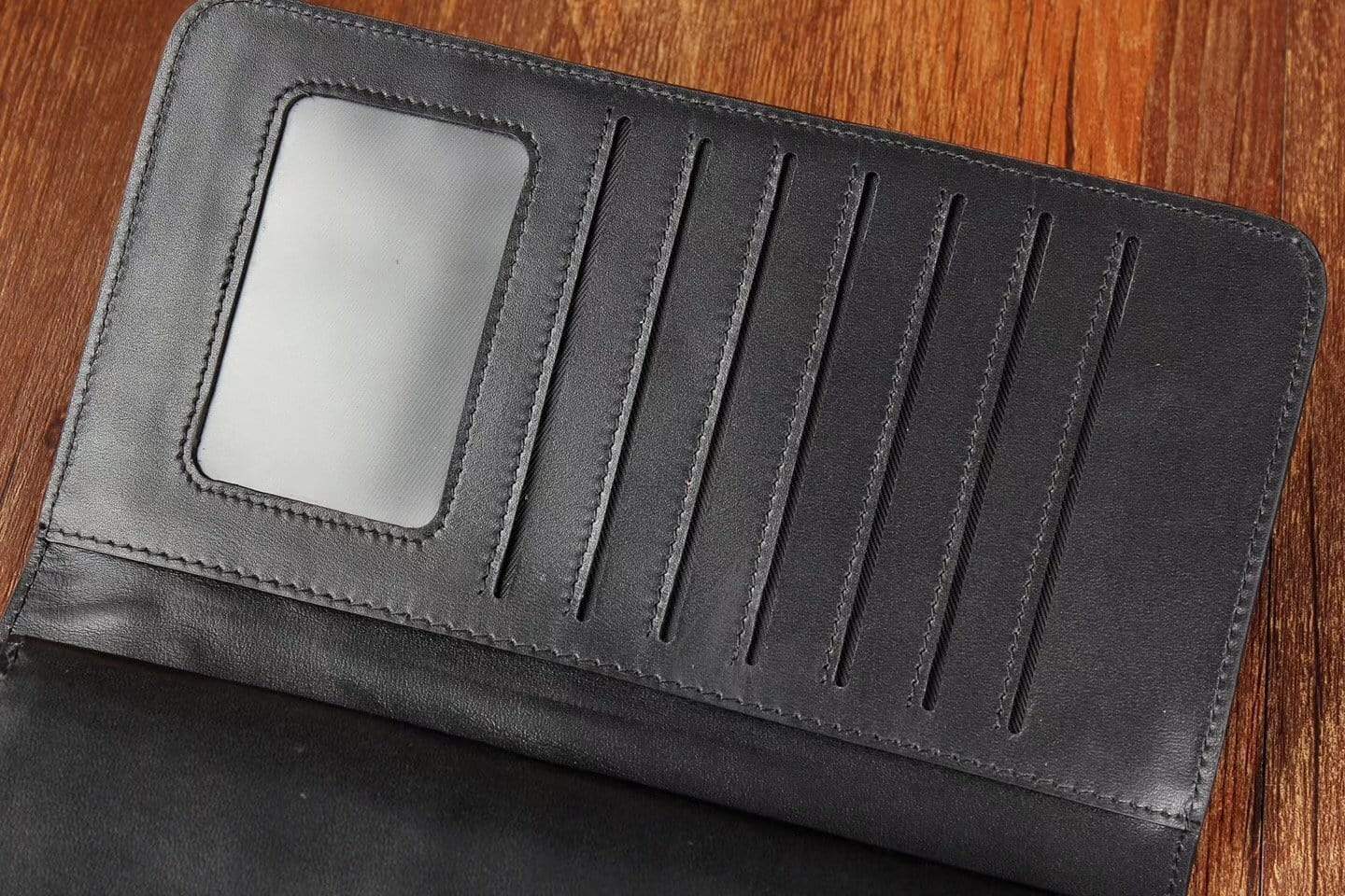Black crocodile skin leather trifold wallet for men by Rossie Viren, featuring a sleek and stylish design with multiple compartments.