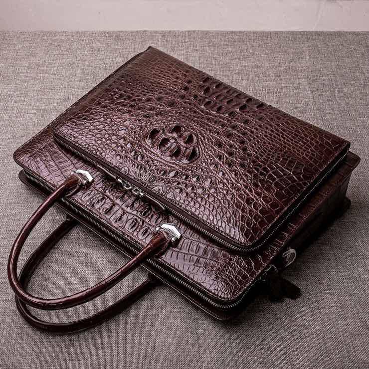 Brown crocodile leather men's briefcase handbag by Rossie Viren, designed for laptops and business use.