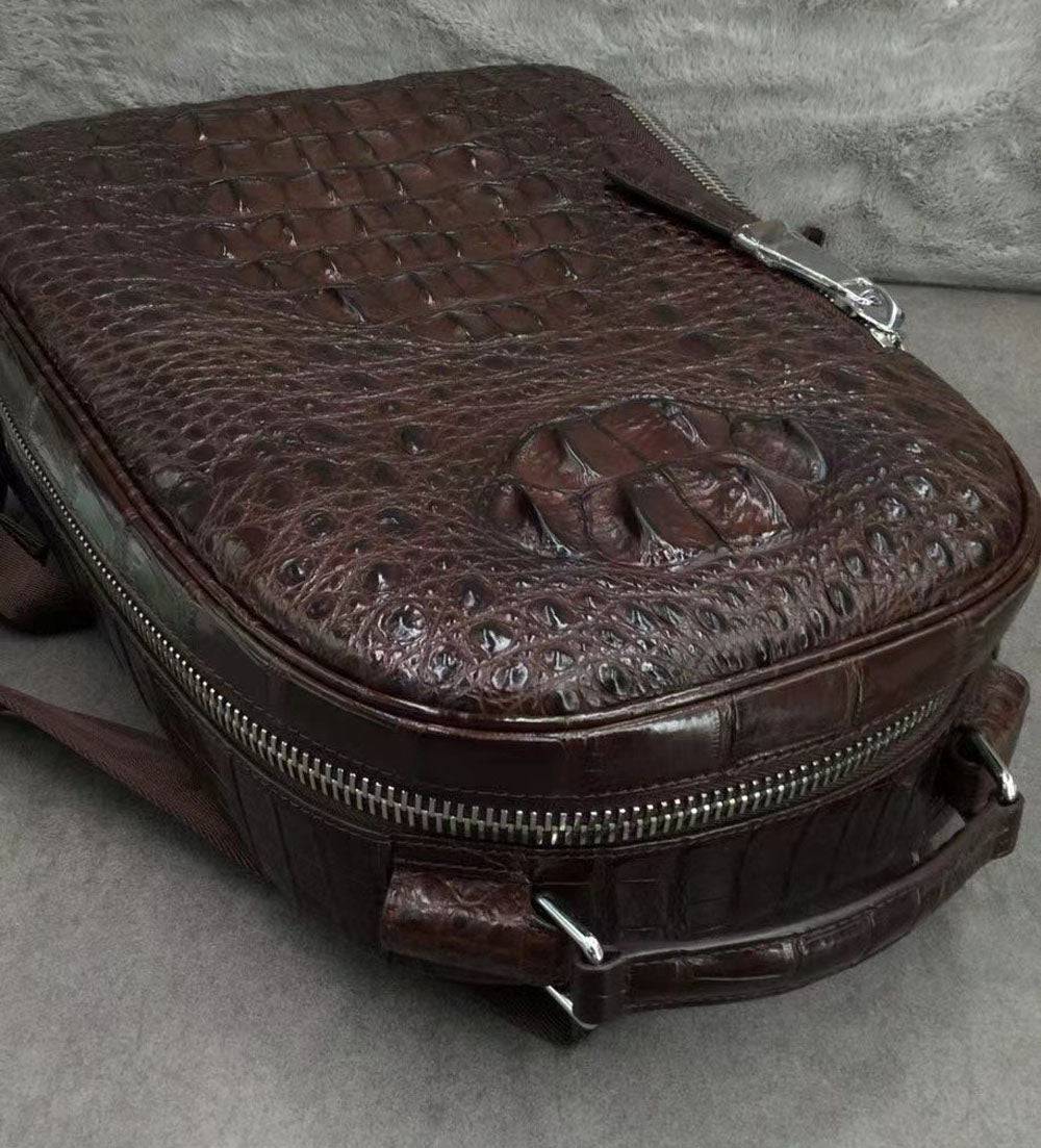 Large Rossie Viren crocodile skin leather backpack with textured crocodile pattern and sturdy straps.