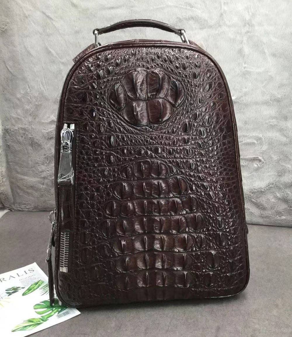 Large Rossie Viren crocodile skin leather backpack with textured crocodile pattern and sturdy straps.