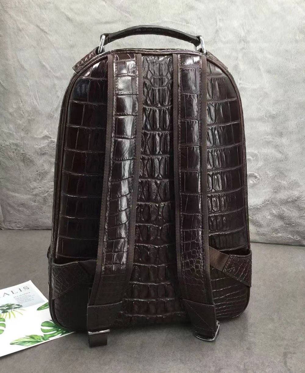 Large Rossie Viren crocodile skin leather backpack with textured crocodile pattern and sturdy straps.