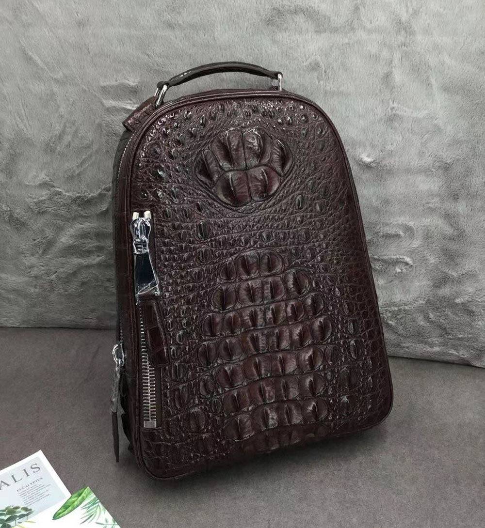 Large Rossie Viren crocodile skin leather backpack showing textured crocodile pattern and sturdy straps.