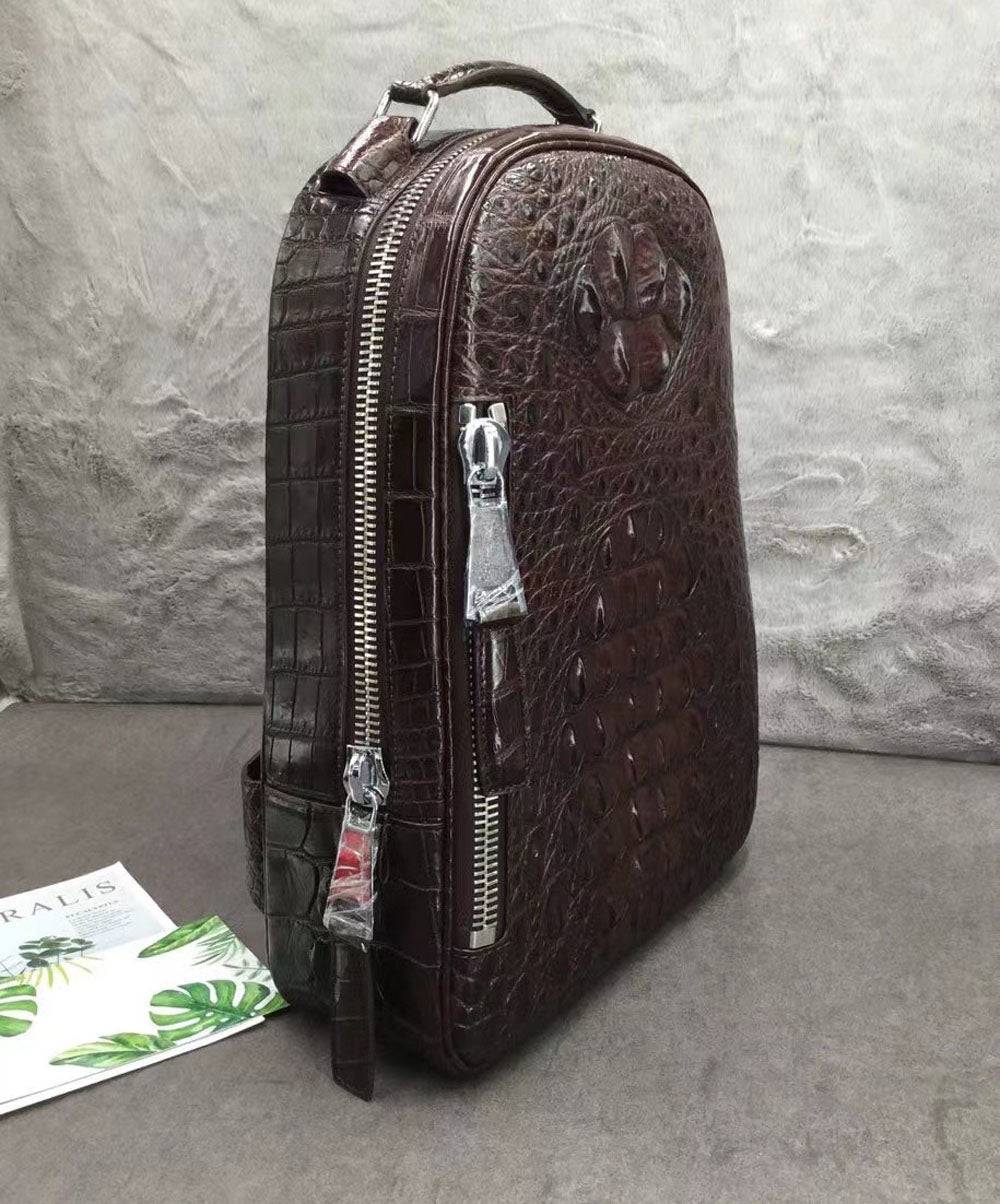 Large Rossie Viren crocodile skin leather backpack with textured crocodile pattern, sturdy straps, and spacious interior.