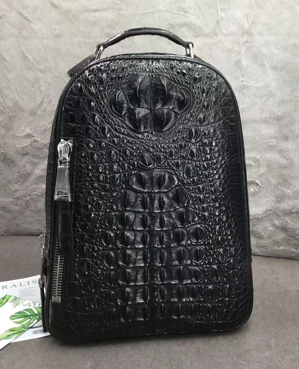 Large Rossie Viren crocodile skin leather backpack showing textured crocodile pattern and sturdy leather straps.