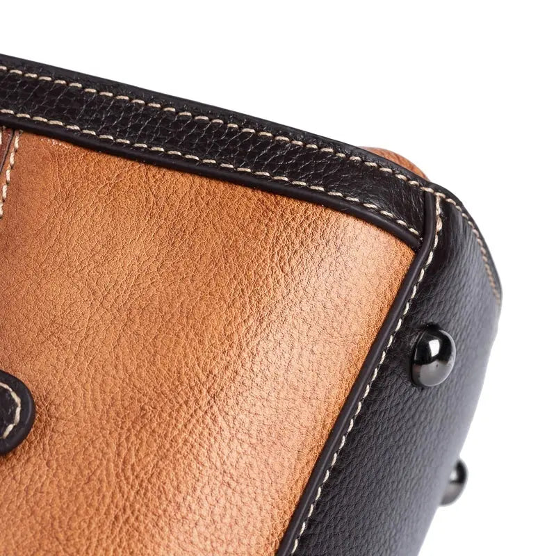 Rossie Viren women's leather top handle shoulder and crossbody handbag with sleek design and structured silhouette.