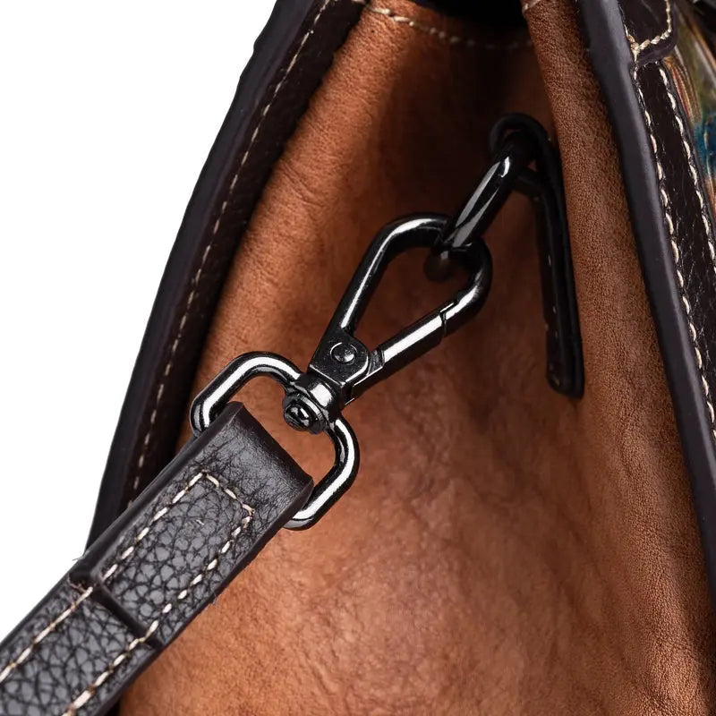 Rossie Viren women's leather top handle shoulder and crossbody handbag with a sleek design and sturdy strap.