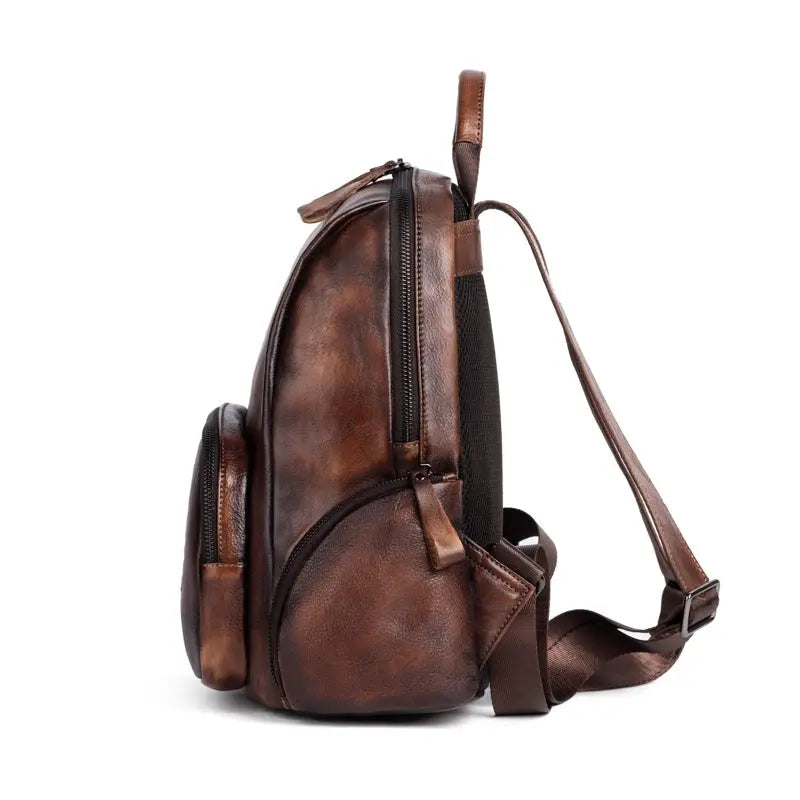 Rossie Viren women's retro genuine leather large backpack with top handle and adjustable straps, suitable for office and travel.