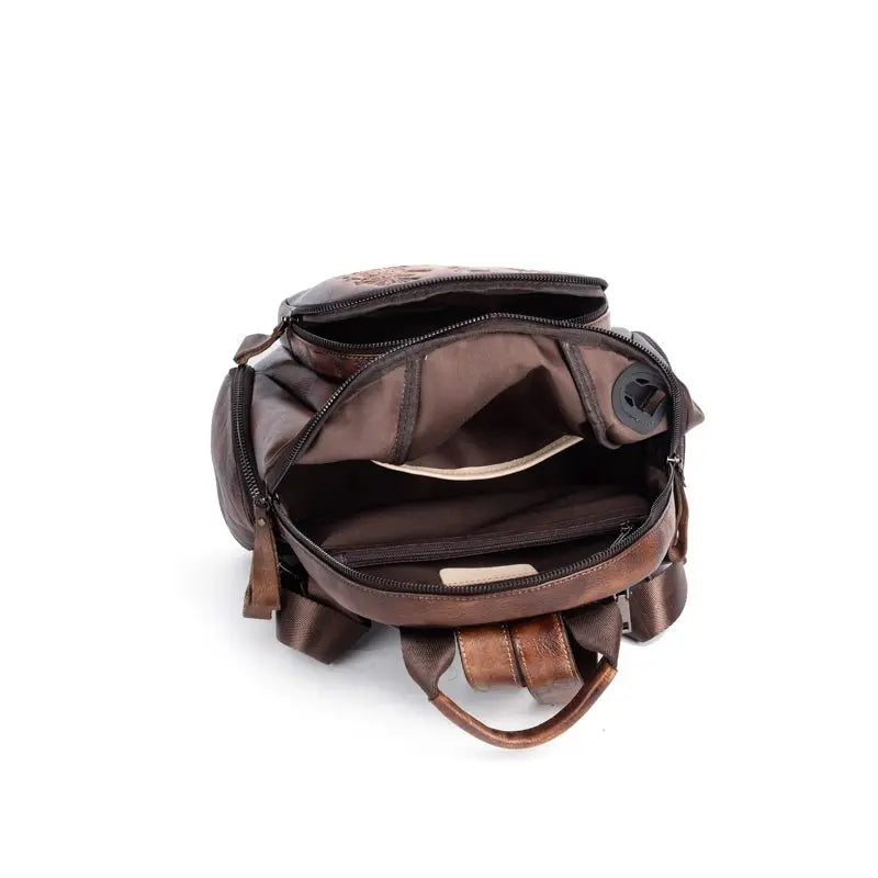 Rossie Viren women's retro genuine leather large backpack, leather rucksack with top handle and adjustable shoulder straps.