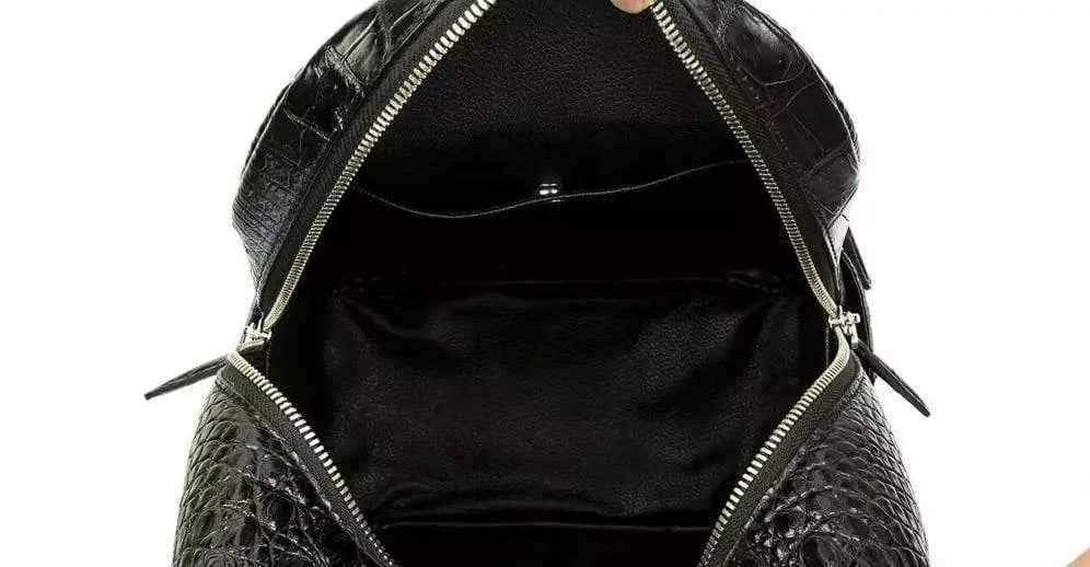 Rossie Viren unisex crocodile skin leather backpack, stylish handbag with textured crocodile pattern and sturdy straps.
