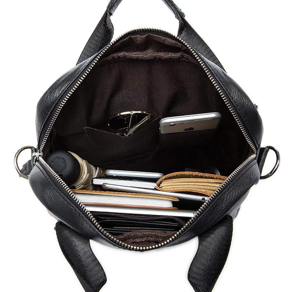 Rossie Viren vertical vintage leather messenger bag for laptop and tablet, featuring a classic handbag design.