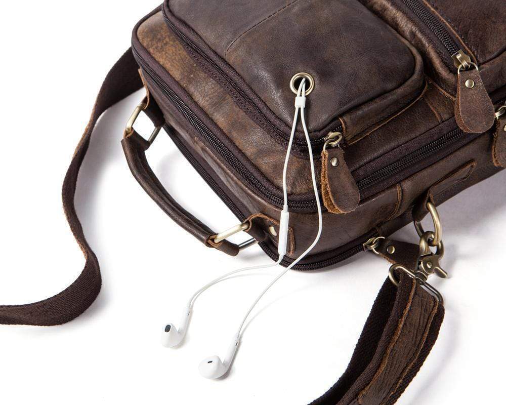 Rossie Viren vintage crossbody handbag with two front pockets, grab handle, and long shoulder strap, stylish and functional.