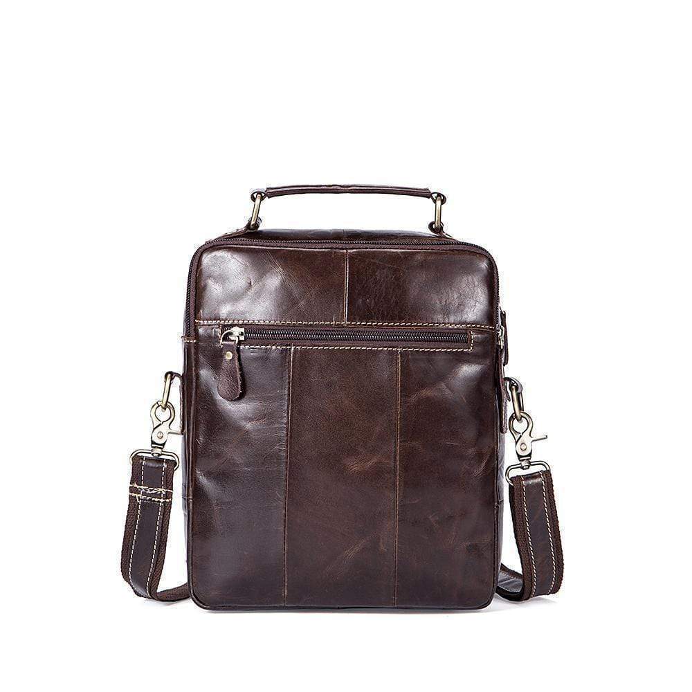 Rossie Viren vintage crossbody handbag with two front pockets, grab handle, and long shoulder strap.