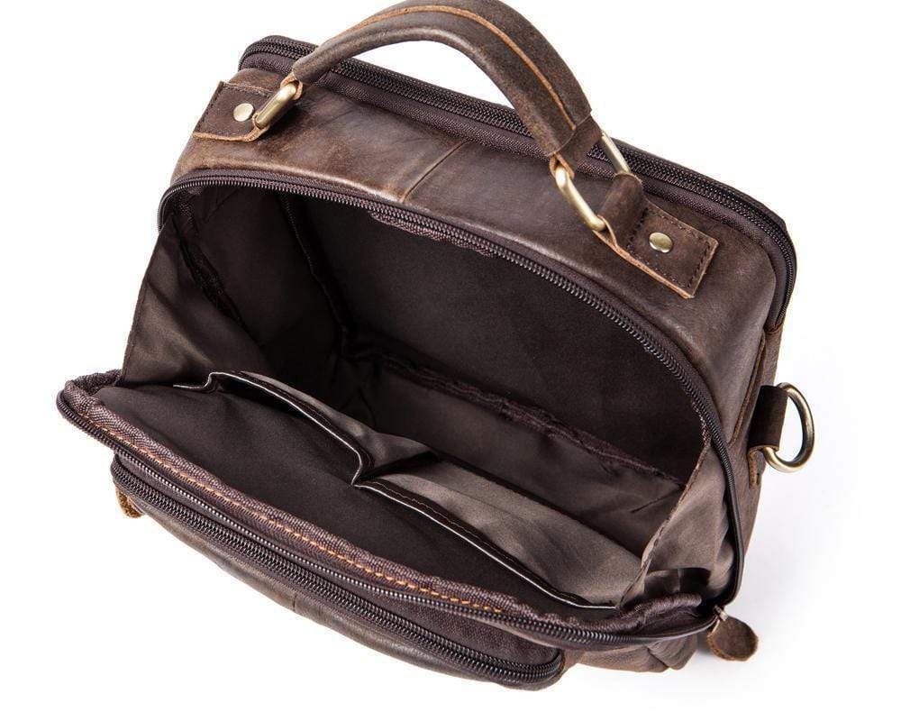 Rossie Viren vintage crossbody handbag with two front pockets, grab handle, and long shoulder strap.