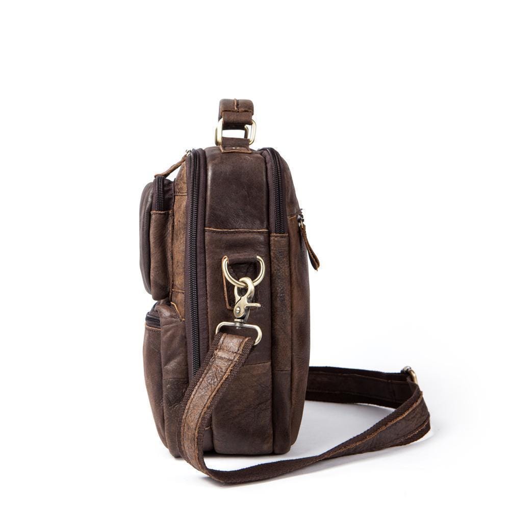 Rossie Viren vintage crossbody handbag with two front pockets, grab handle, and long shoulder strap.