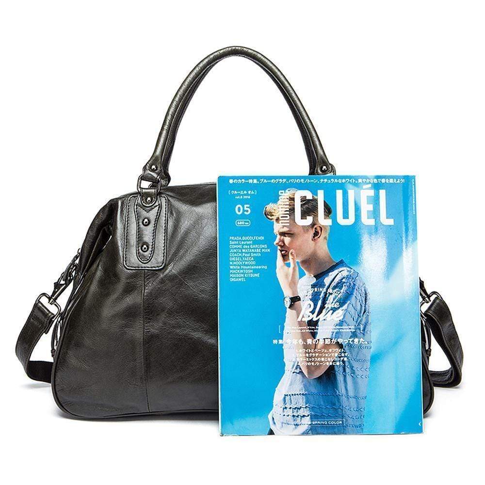 Rossie Viren vintage leather large travel carry-all unisex weekender duffel shoulder bag with sturdy handles and spacious interior.