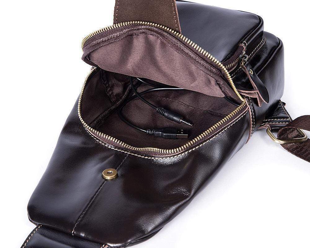 Rossie Viren vintage leather sling bag with USB charging port, shoulder strap, ideal for outdoor travel and daily use.