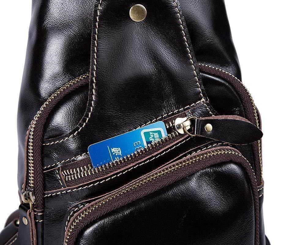 Rossie Viren vintage leather sling bag with USB charging port, crossbody design, ideal for outdoor sport and travel, men's chest bag.