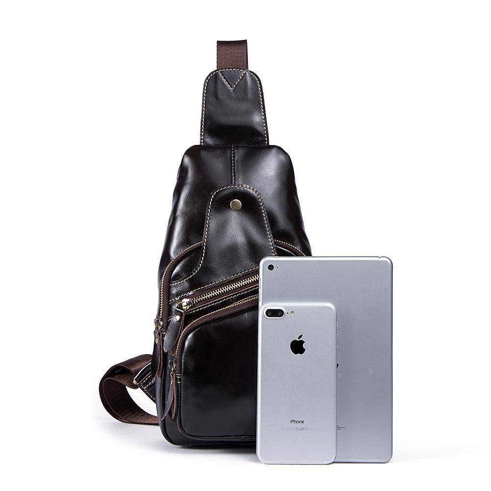 Rossie Viren vintage leather sling bag with shoulder strap, USB charging port, crossbody design, ideal for outdoor travel and day trips.