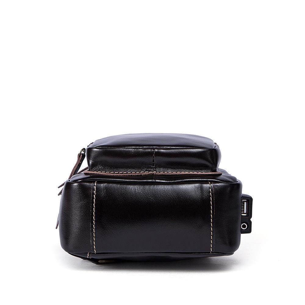 Rossie Viren vintage leather sling bag with USB charging port, crossbody design, outdoor and travel-ready men's chest bag.