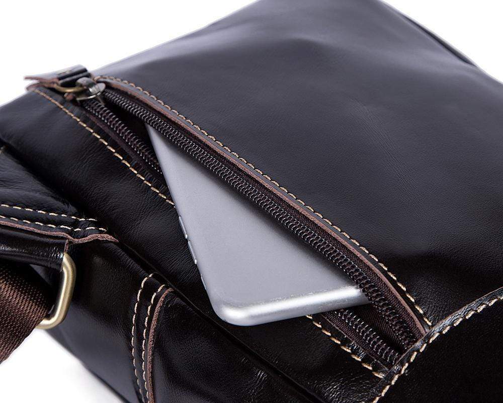 Rossie Viren vintage leather sling bag with USB charging port, crossbody design, ideal for outdoor sports, travel, and daily use.