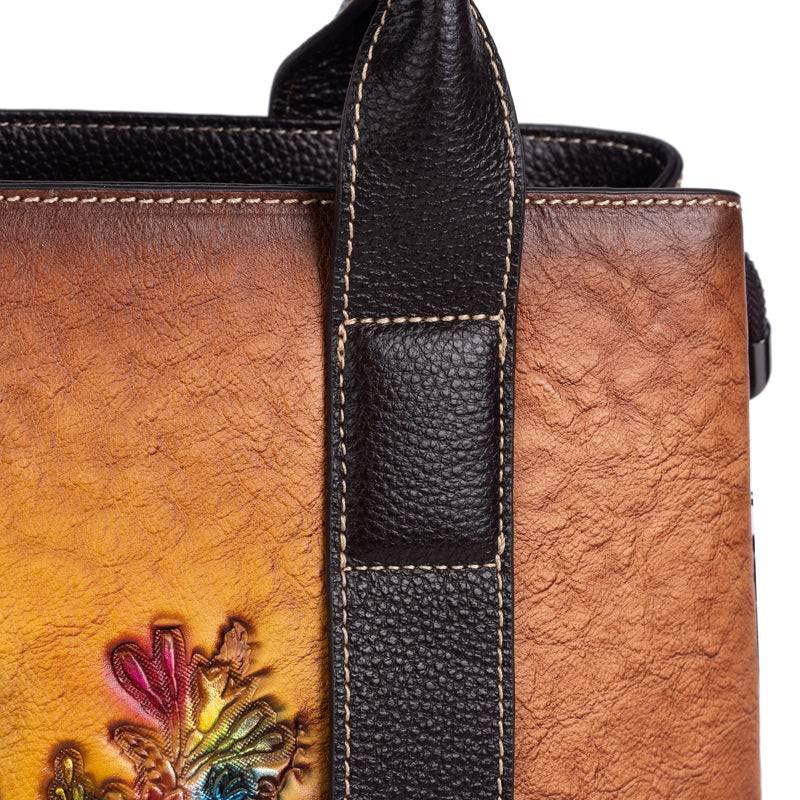 Rossie Viren women's leather handbag with top handle and crossbody strap, featuring a tote and shoulder bag design.