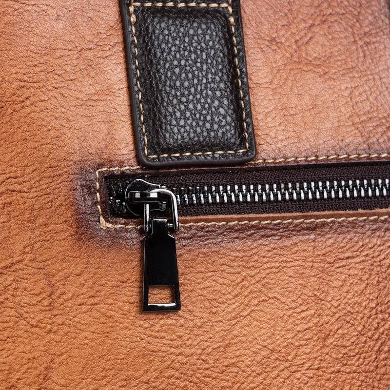 Rossie Viren women's leather handbag with top handle, crossbody strap, tote style, and shoulder bag design.