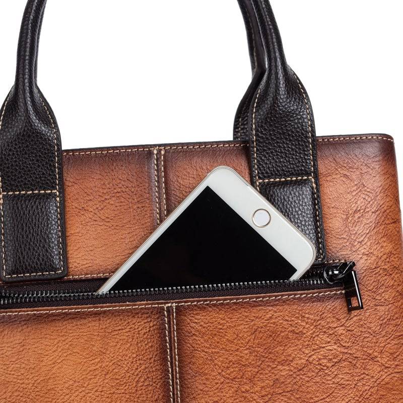 Rossie Viren women's leather handbag featuring top handle, crossbody strap, tote style, and shoulder bag design.