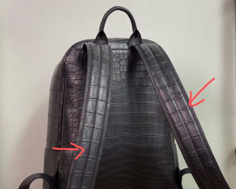 Large black crocodile leather backpack with adjustable shoulder straps by Rossie Viren, featuring a textured crocodile pattern.