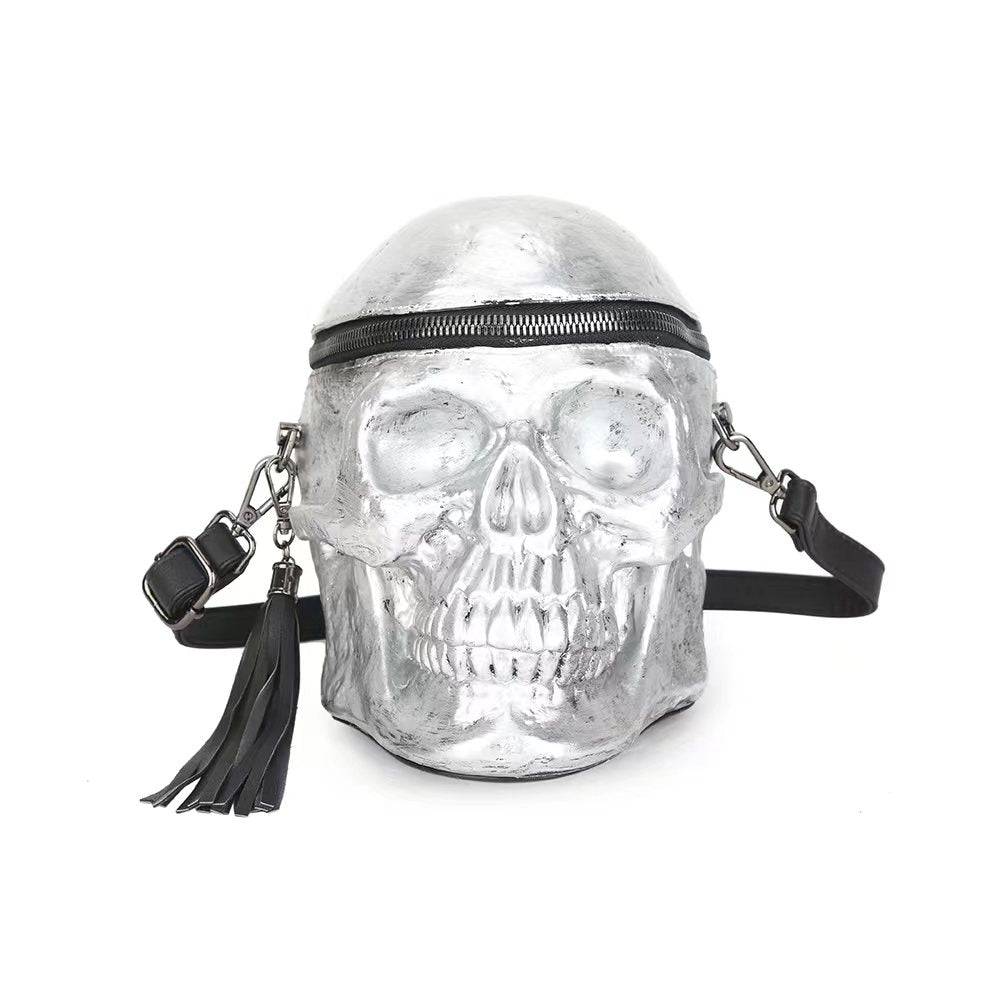 Silver 3D skull crossbody shoulder bag by Rossie Viren with a mini handle and stylish design.