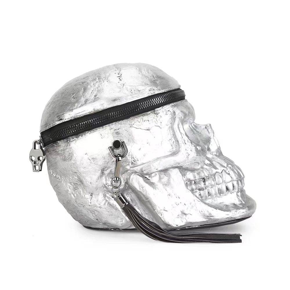 Silver 3D skull crossbody handle bag by Rossie Viren featuring a mini size and unique design, perfect for stylish everyday use.