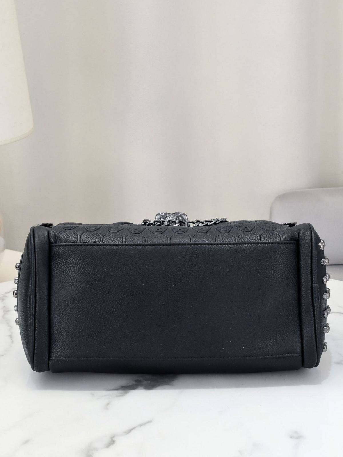 Rossie Viren 3D crystal skull shoulder bag with studded details, featuring a unique skull design and a stylish satchel style.