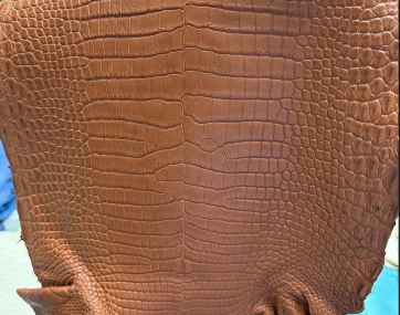 Tan crocodile leather golf head cover handbag by Rossie Viren, featuring a luxurious textured leather design.