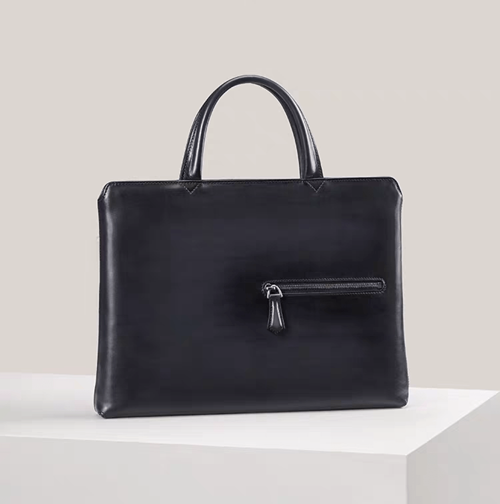 Vintage 15-inch leather laptop briefcase handbag by Rossie Viren, featuring classic design and sturdy leather construction.