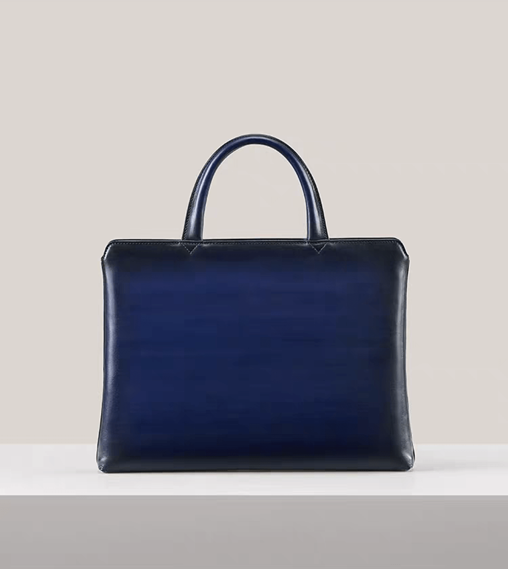 15-inch vintage leather laptop briefcase handbag by Rossie Viren, featuring a classic design with sturdy handles and leather finish.