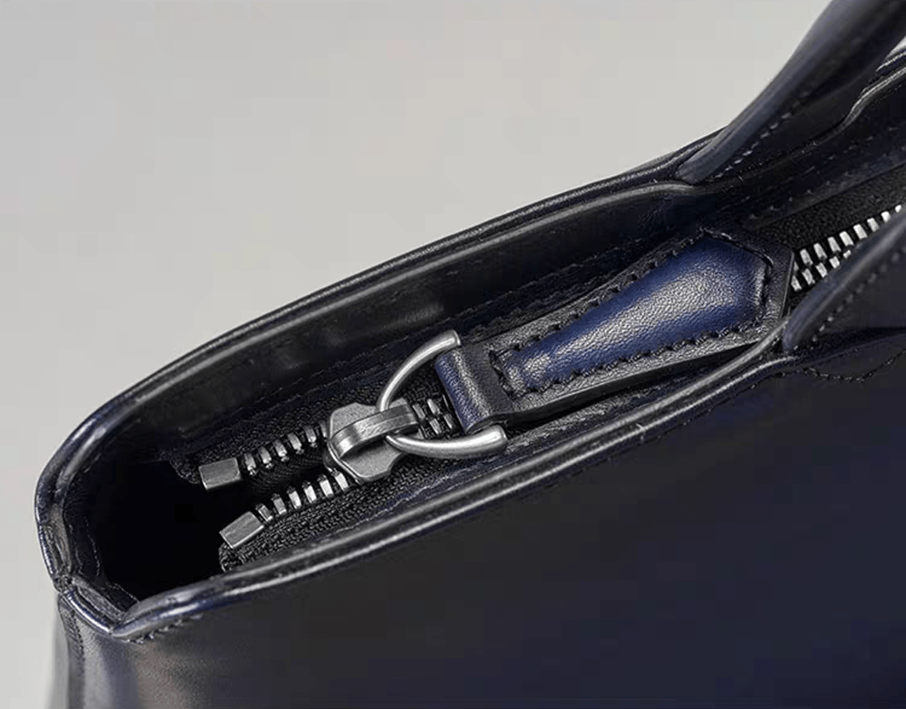 15-inch vintage leather laptop briefcase handbag by Rossie Viren, featuring a classic design with sturdy handles and leather finish.
