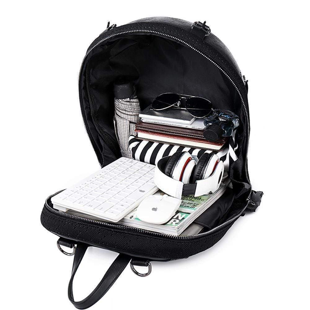 Small unisex Kreepsville 3D skull backpack handbag with bold skull design and adjustable straps, by Rossie Viren.