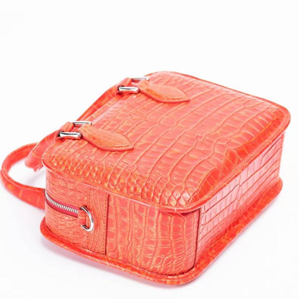 Vintage orange crocodile leather handbag with small top handle and tote style by Rossie Viren.
