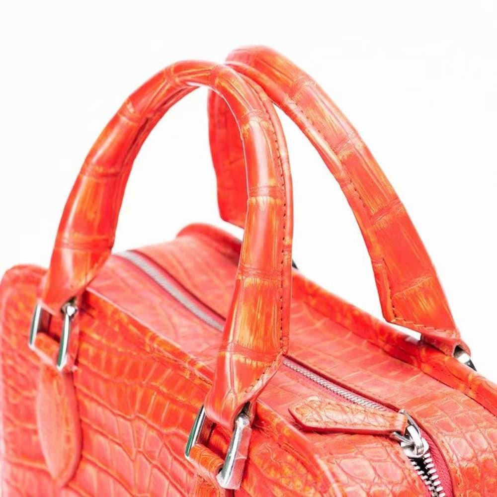 Orange crocodile leather small top handle tote bag by Rossie Viren, featuring a vintage-style handbag with a structured design.