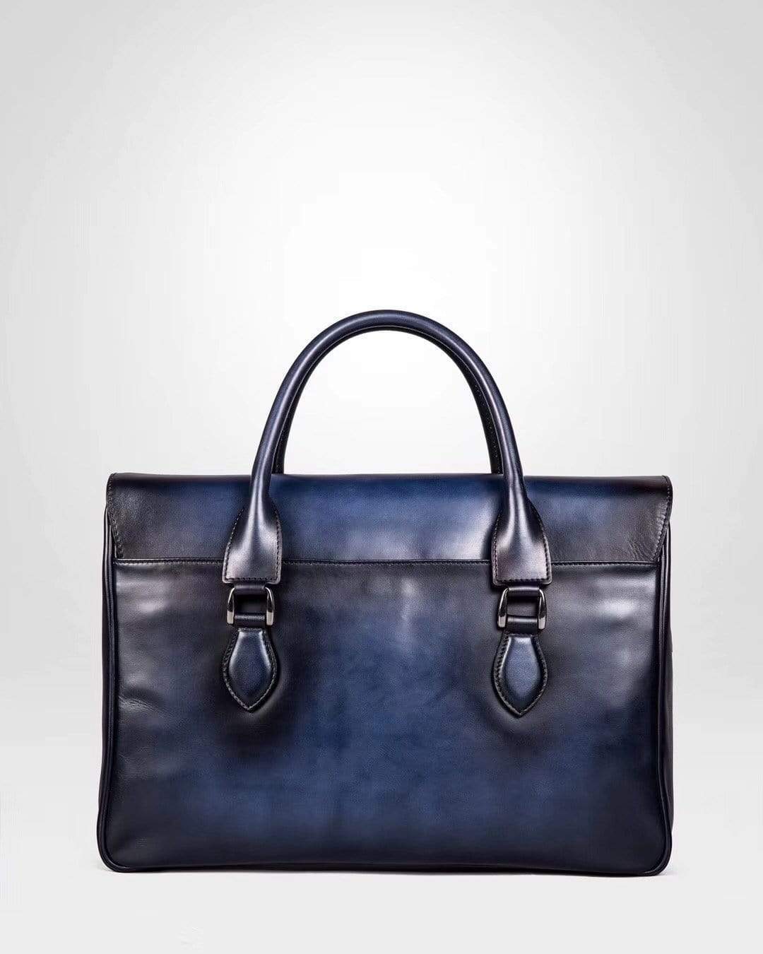 Blue vintage large cowhide leather foldover briefcase handbag by Rossie Viren, smooth textured design with sturdy handles.