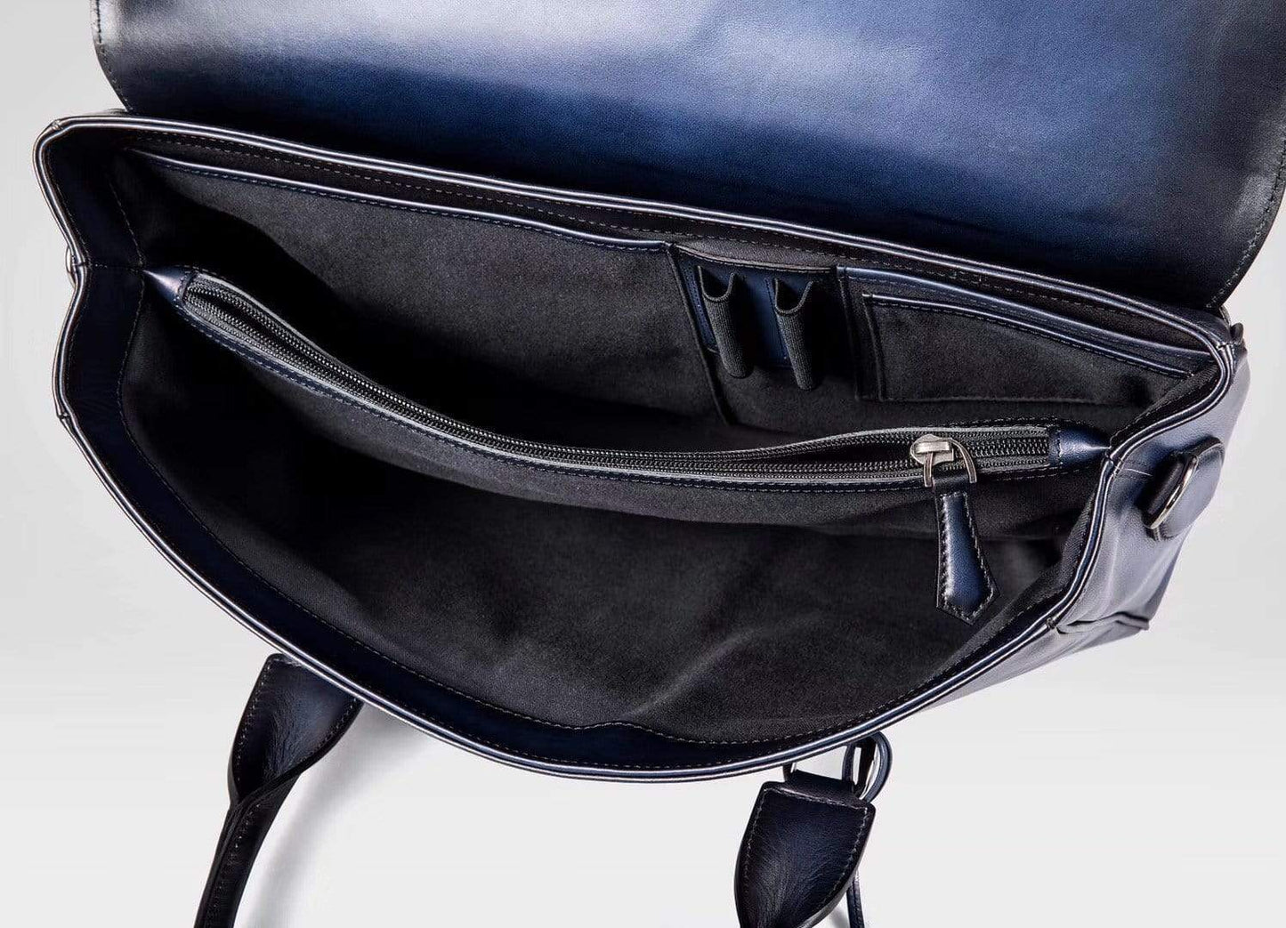 Vintage large blue cowhide leather foldover briefcase handbag by Rossie Viren, showcasing smooth leather and classic design.