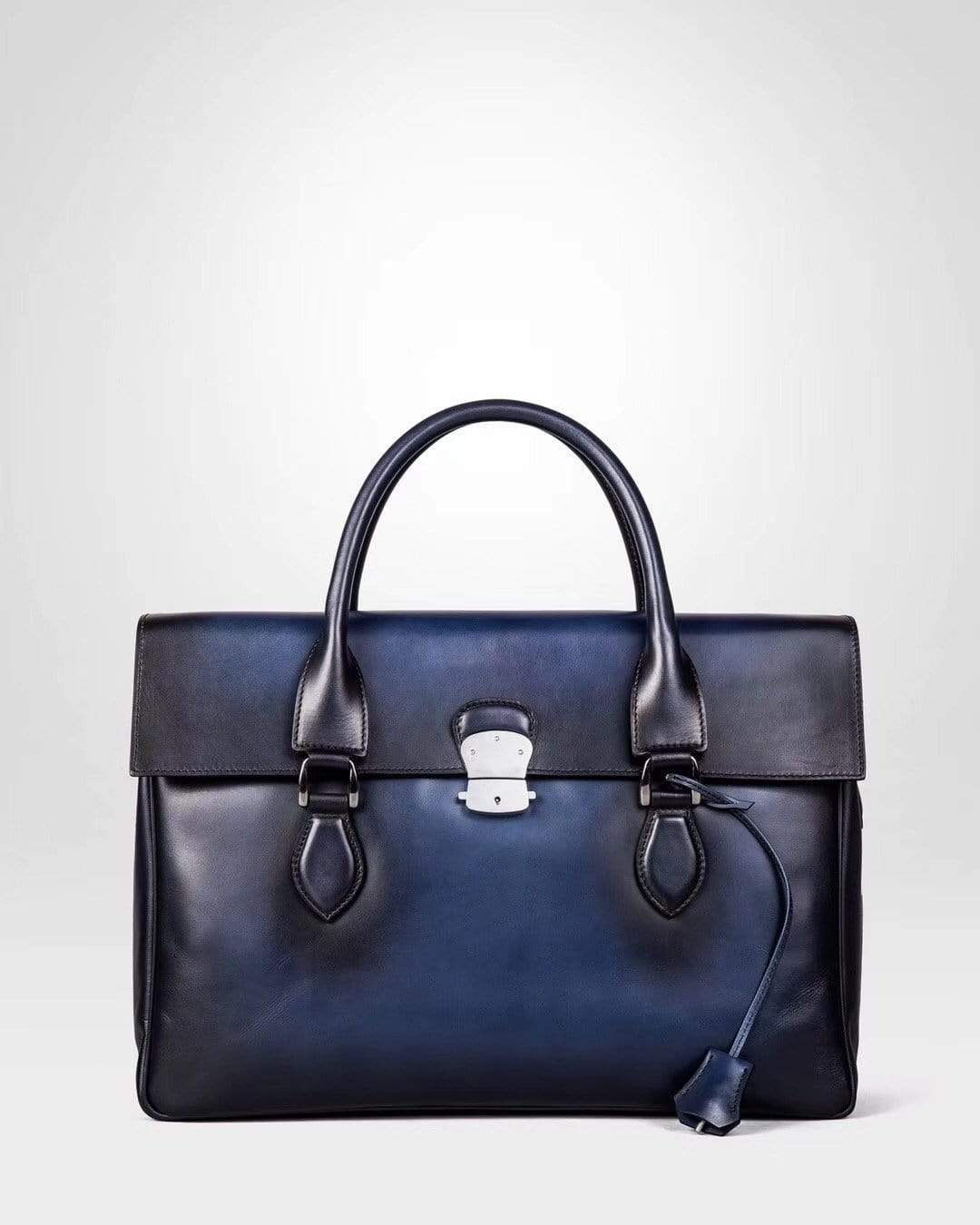 Vintage large blue cowhide leather foldover briefcase handbag by Rossie Viren, featuring smooth texture and classic design.