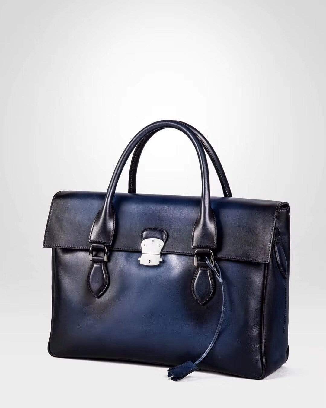 Blue vintage cowhide leather foldover briefcase handbag by Rossie Viren, featuring a smooth, large, and classic design.
