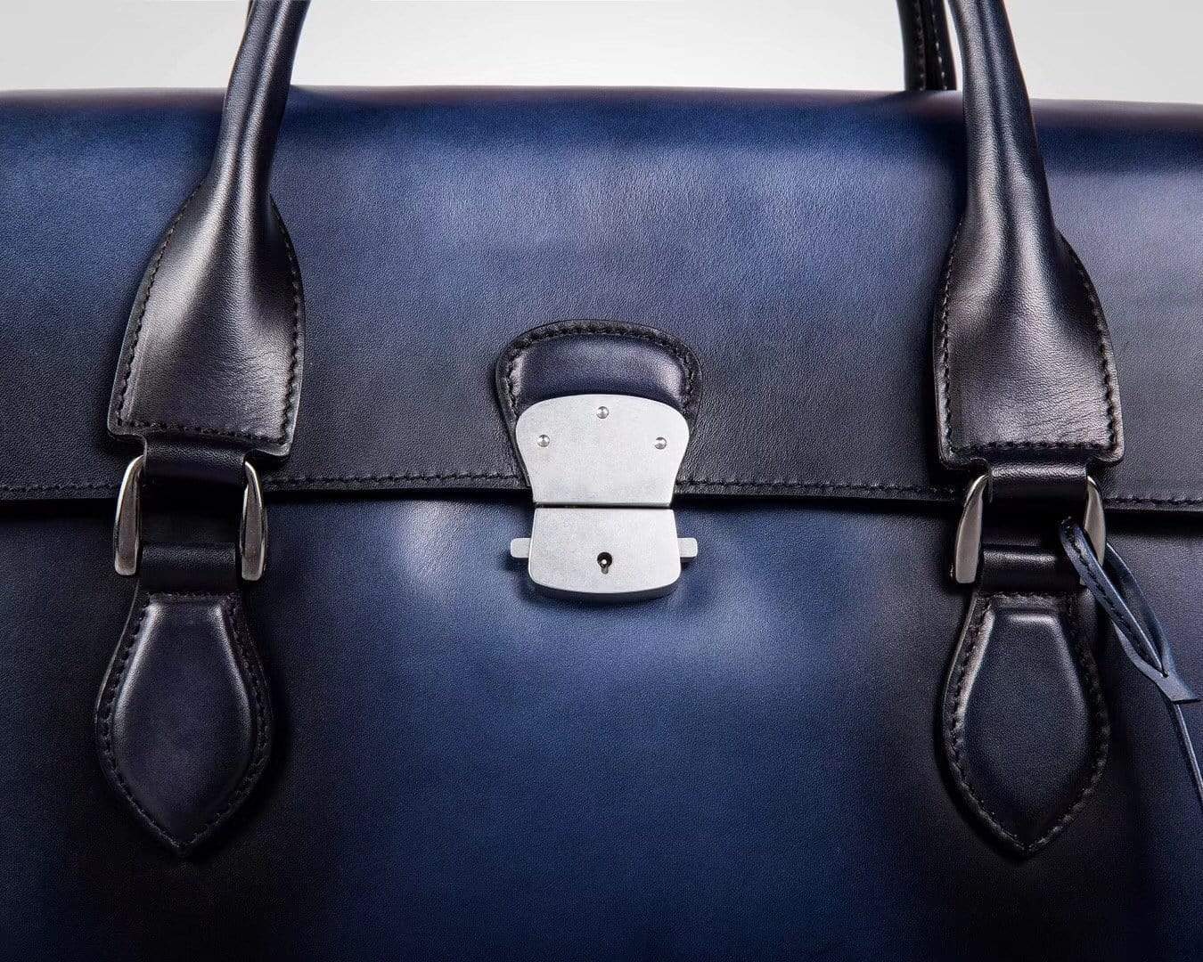Blue vintage leather foldover briefcase by Rossie Viren, made from large smooth cowhide with a classic handbag design.