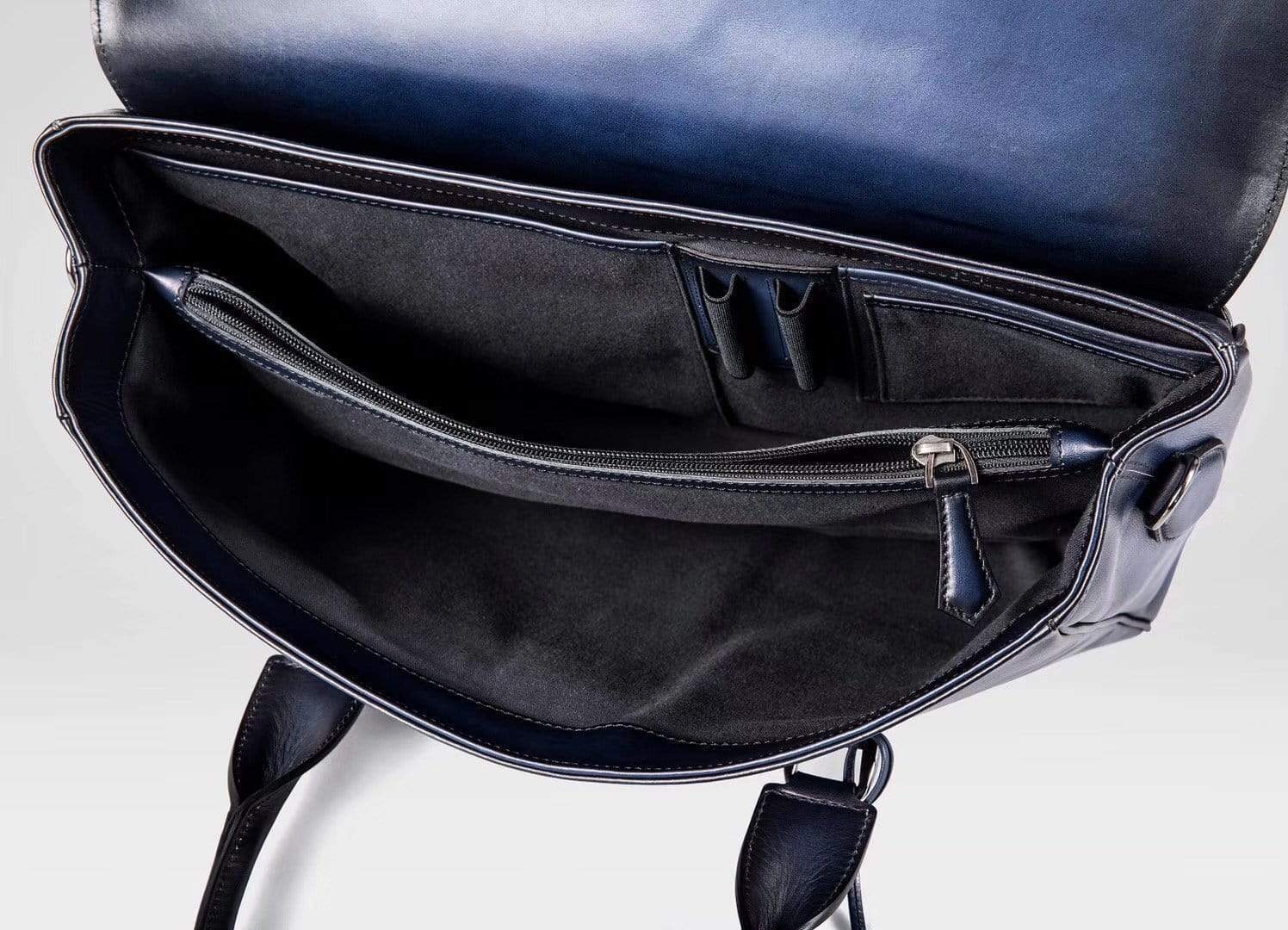 Vintage large blue cowhide leather foldover briefcase handbag by Rossie Viren with smooth texture and classic design.