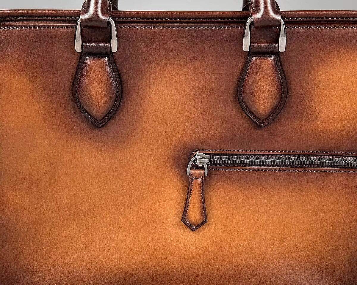 Vintage Rossie Viren cowhide leather handbag with a smooth finish, featuring a classic briefcase and messenger bag style.