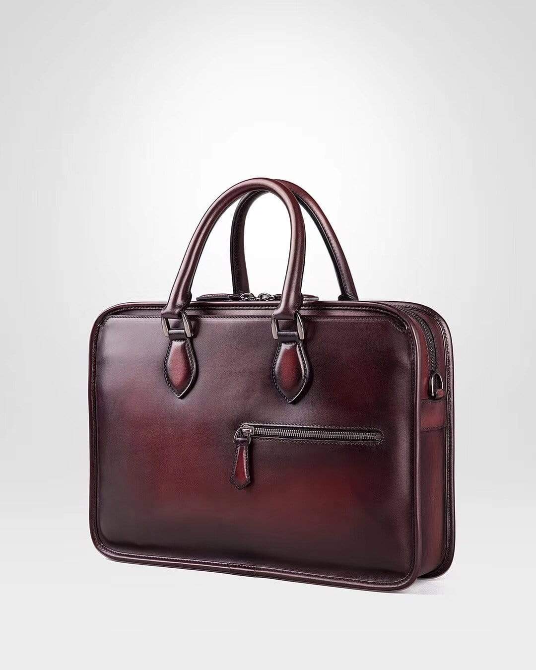 Vintage smooth cowhide leather handbag by Rossie Viren, featuring a classic design with sturdy handles and spacious interior.